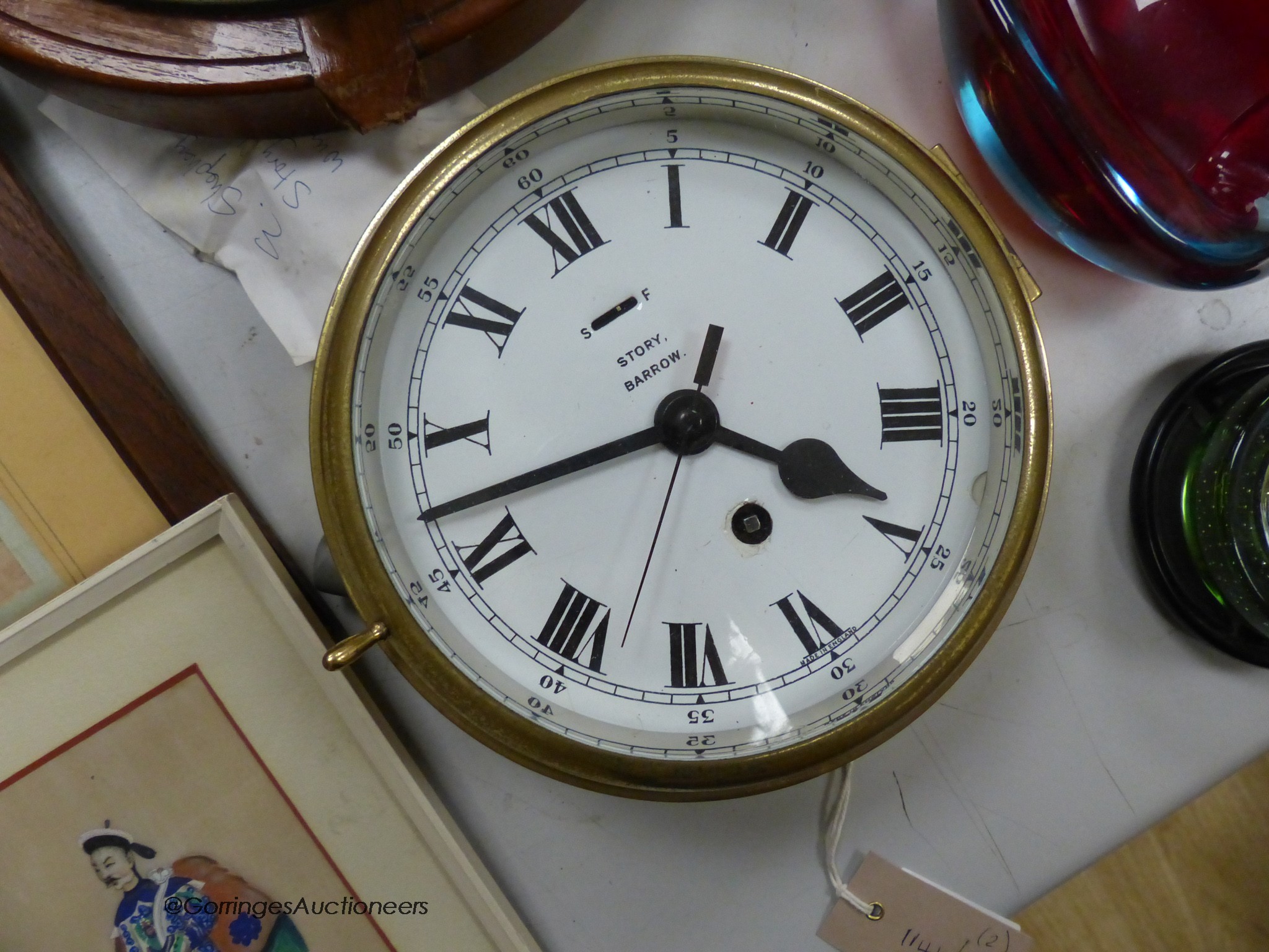 A brass bulkhead timepiece, enamelled dial signed Story, Barrow, dial 17cm, and a ship's wheel wall timepiece by Bayard